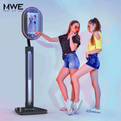 An MWE Mirror Photo Booth is shown as a full-length interactive imaging display.